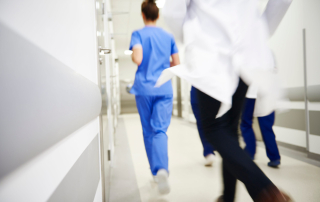 hospital workers run from emergency